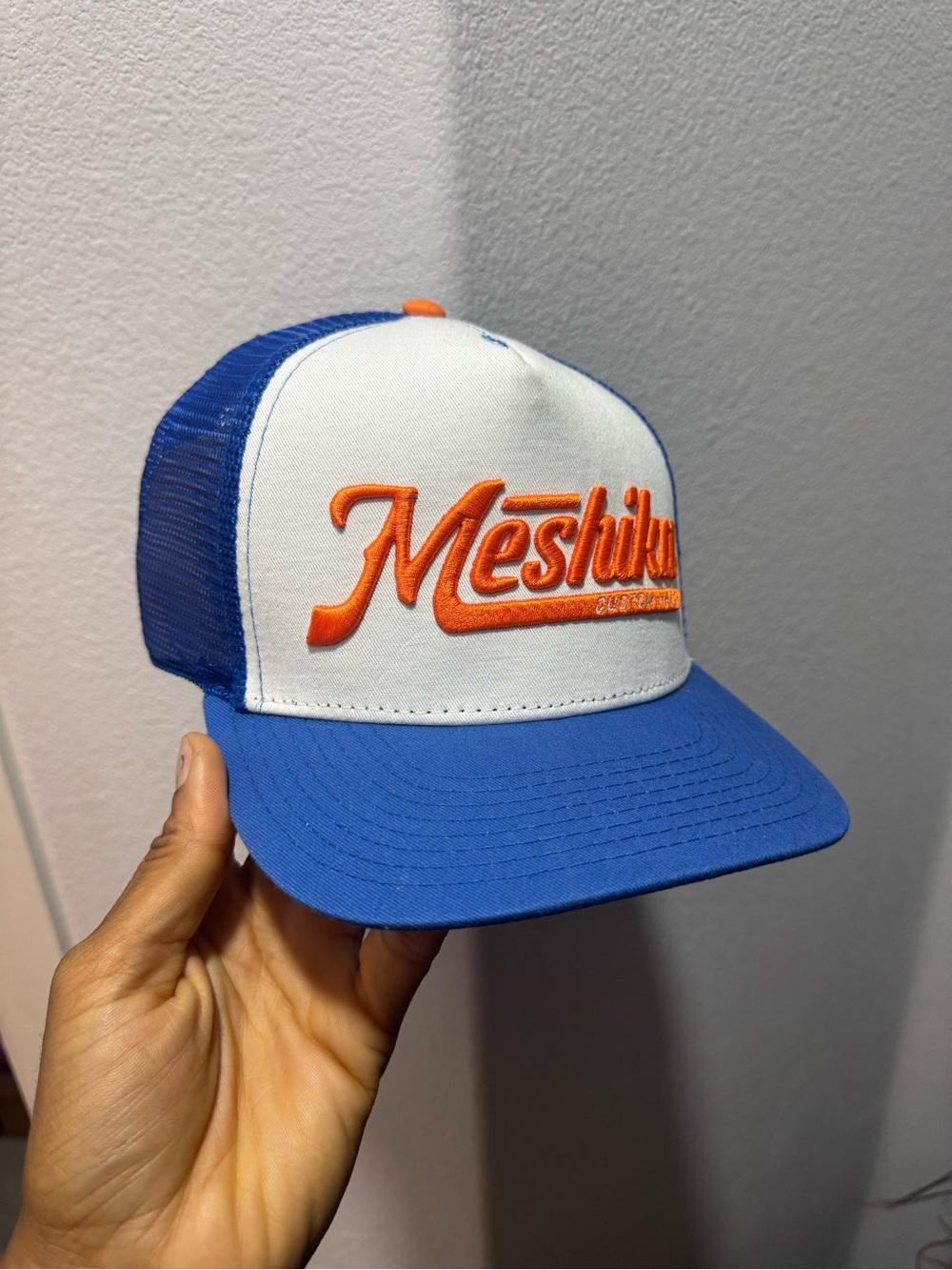 Meshika Blue & White Trucker Cap with Orange Logo